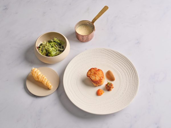 Michelin-starred dish with accompaniments at Wild Honey St James