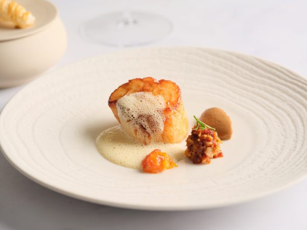 Seasonal fish dish presented at Wild Honey St James in London
